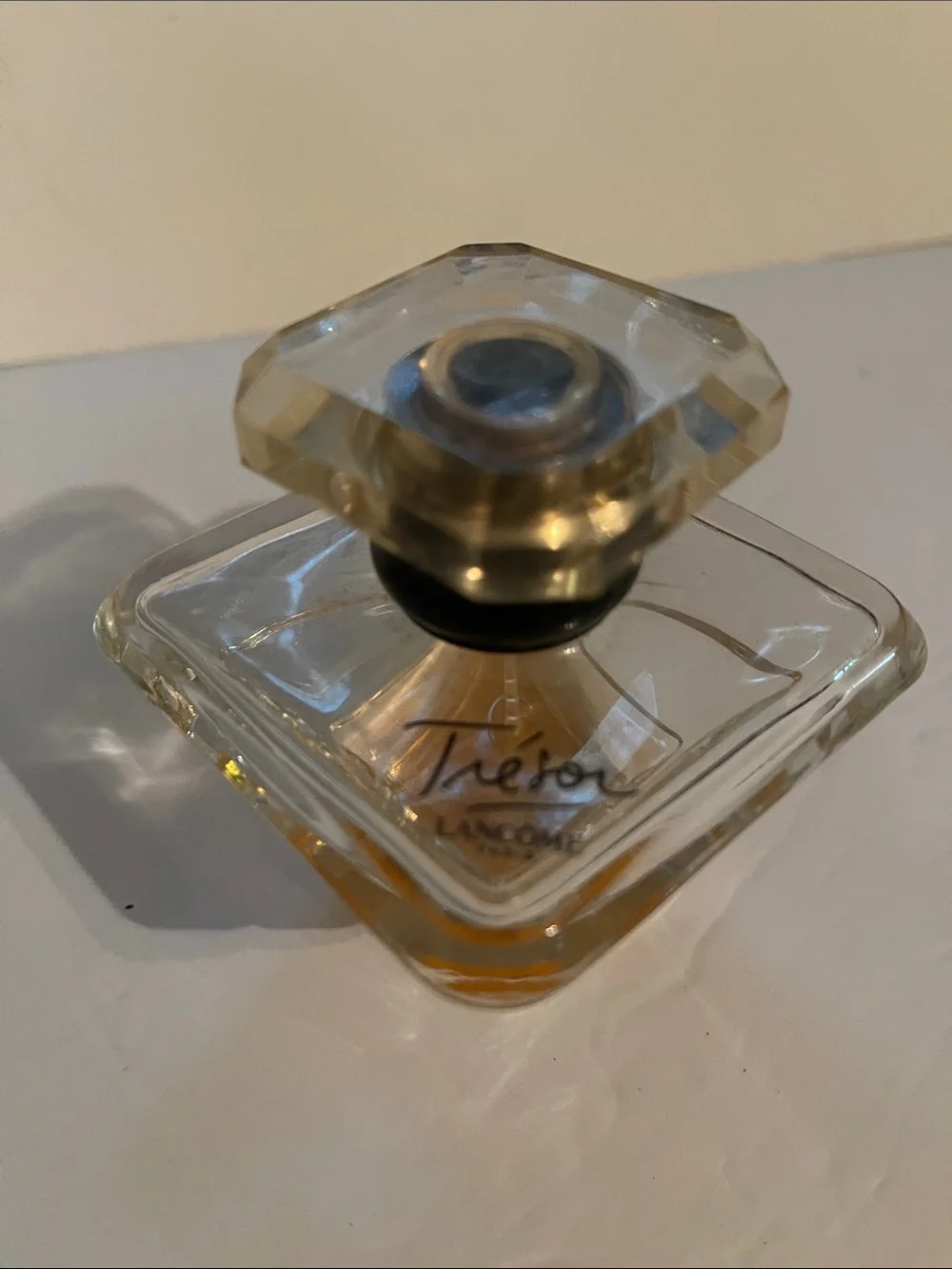 Trésor by Lancôme 1/4 if a 1.7 fl oz bottle